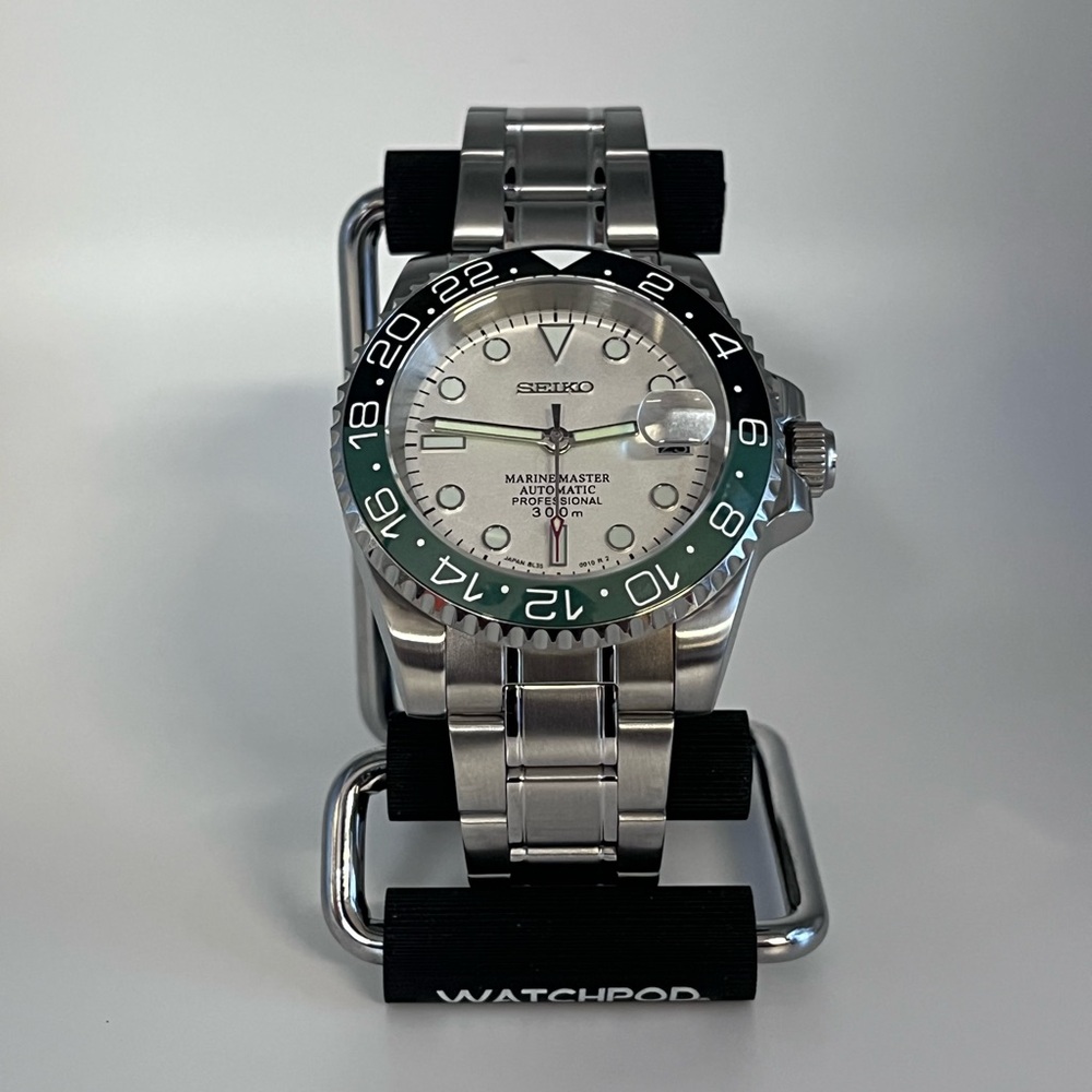 Seiko Silver Watch with Green Accents
